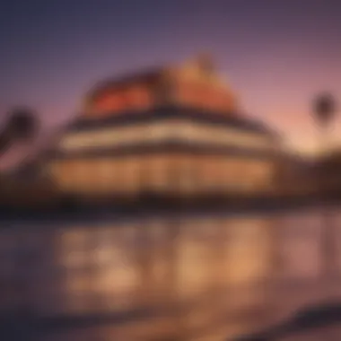 Scenic view of a beachside casino illuminated at sunset