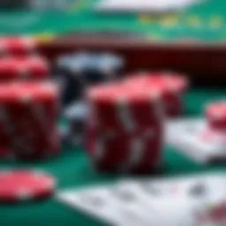 A close-up view of poker chips and cards on a green felt table