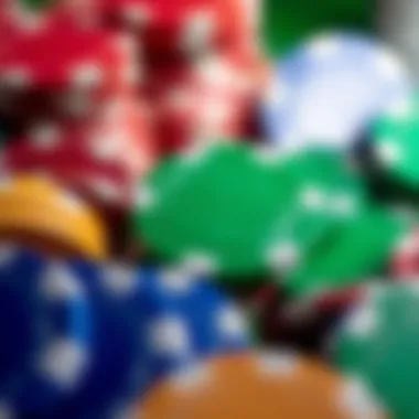 A close-up view of a green casino chip surrounded by other colored chips.
