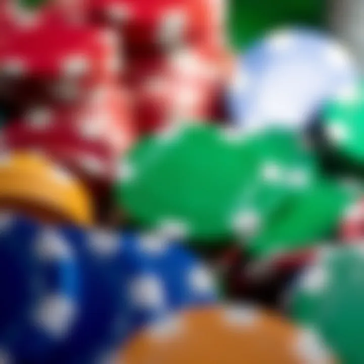 A close-up view of a green casino chip surrounded by other colored chips.